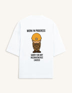 Back view of a premium white unisex oversized t-shirt featuring a small cartoon character graphic.