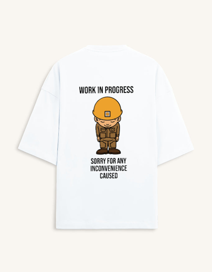 Back view of a premium white unisex oversized t-shirt featuring a small cartoon character graphic.