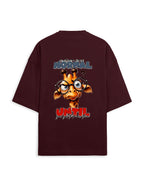 A dark maroon oversized t-shirt with a large graphic print on the back. The graphic features a cartoon giraffe wearing round black glasses, with the text 'is normal UNTIL' in stylized blue and red fonts.