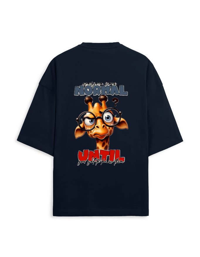 A navy blue oversized t-shirt with a large graphic print on the back. The graphic features a cartoon giraffe wearing round glasses, with the text 'are you NORMAL' above and 'UNTIL' below in red and white.