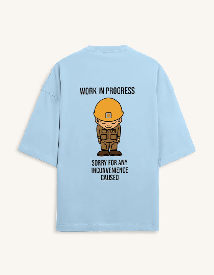 Back view of a premium white unisex oversized t-shirt featuring a small cartoon character graphic.