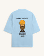 Back view of a premium white unisex oversized t-shirt featuring a small cartoon character graphic.