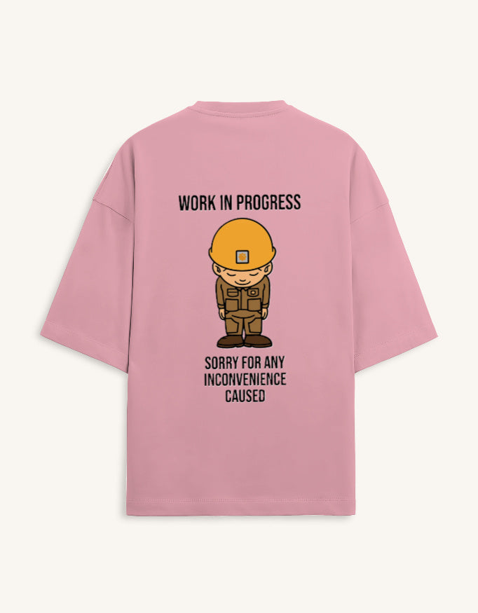 Back view of a premium white unisex oversized t-shirt featuring a small cartoon character graphic.