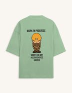 Back view of a premium white unisex oversized t-shirt featuring a small cartoon character graphic.