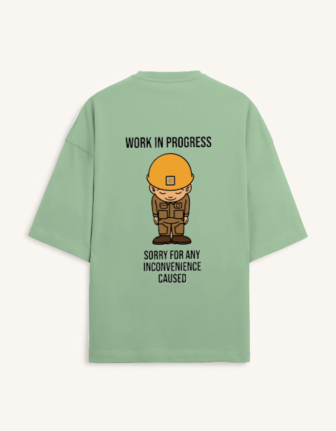 Back view of a premium white unisex oversized t-shirt featuring a small cartoon character graphic.