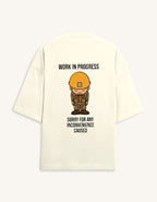Back view of a premium white unisex oversized t-shirt featuring a small cartoon character graphic.