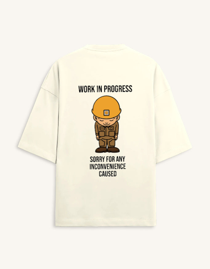 Back view of a premium white unisex oversized t-shirt featuring a small cartoon character graphic.