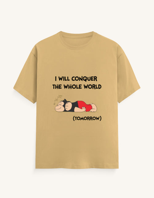 Front view of a mustard-colored unisex classic crew neck t-shirt featuring a sleeping cartoon monkey and the text "I WILL CONQUER THE WHOLE WORLD (TOMORROW)" printed on the center chest.