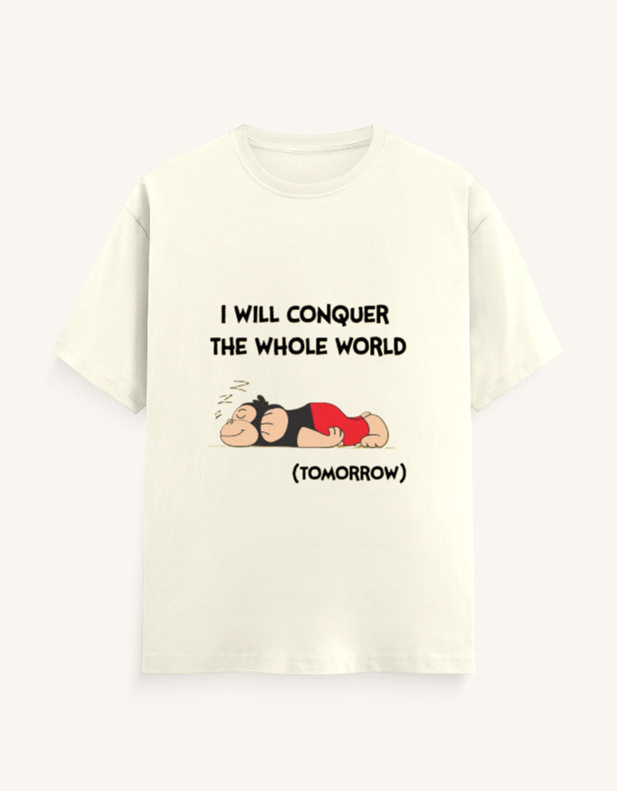 Front view of a mustard-colored unisex classic crew neck t-shirt featuring a sleeping cartoon monkey and the text "I WILL CONQUER THE WHOLE WORLD (TOMORROW)" printed on the center chest.