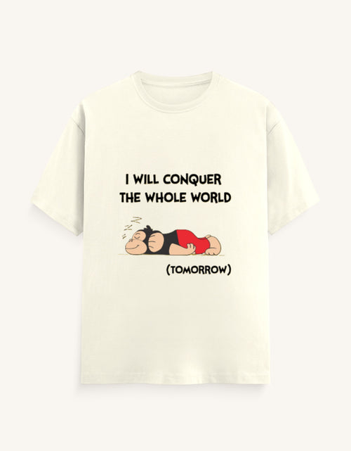 Front view of a mustard-colored unisex classic crew neck t-shirt featuring a sleeping cartoon monkey and the text "I WILL CONQUER THE WHOLE WORLD (TOMORROW)" printed on the center chest.