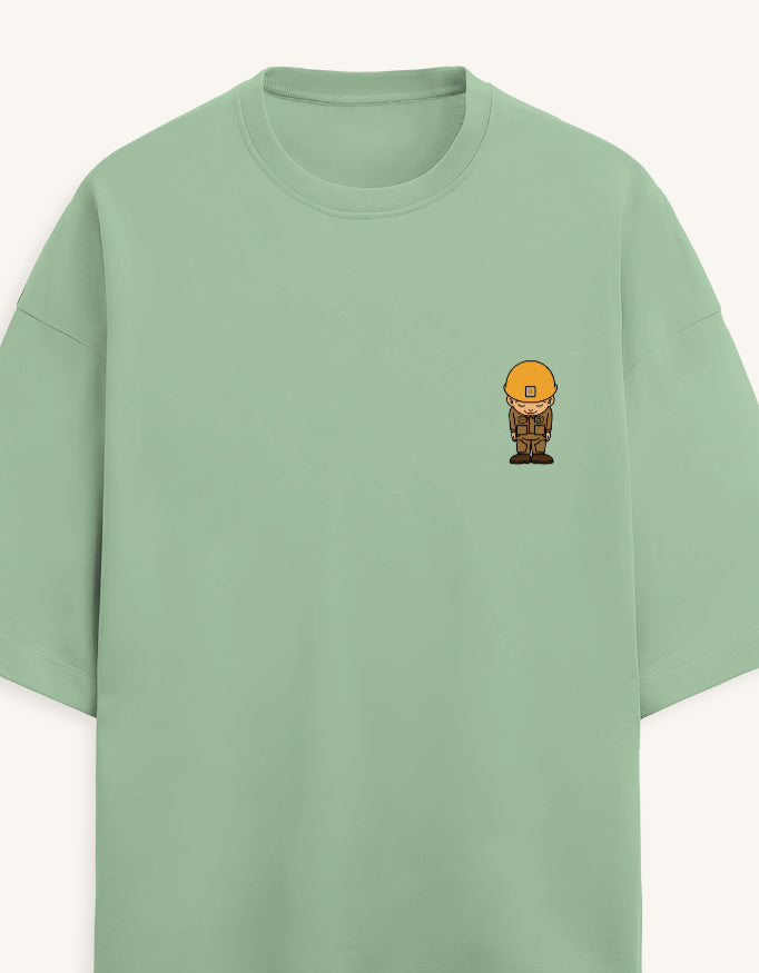 Front view of a premium white unisex terry oversized t-shirt featuring a small cartoon character graphic on the left chest pocket area.